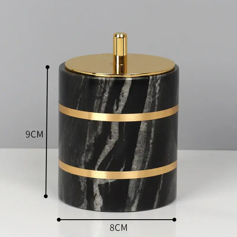 Black marble bathroom cylindrical container with gold bands and vertical stripe pattern from DecorBites black marble set