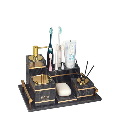 Decorbites black marble bathroom accessories set with gold accents multiple compartments holding toiletries