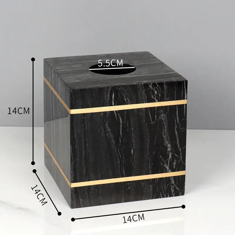 Decorbites black marble tissue box with gold accent stripes in a black marble bathroom accessories set