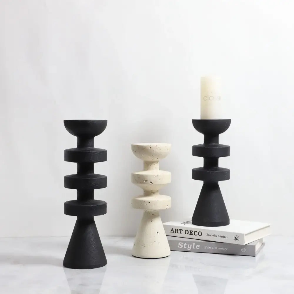 DecorBites™ black marble candle holder with stacked circular rings and a yellow stone conical base design