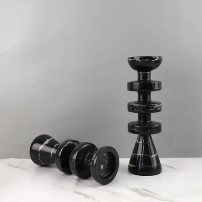 DecorBites™ black marble candle holder with sleek stacked rings and glossy finish complements modern yellow stone décor