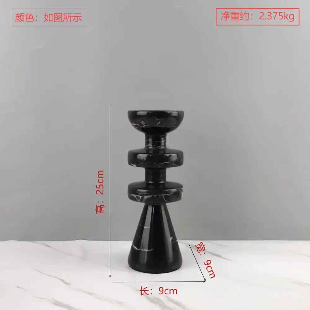 DecorBites™ black marble candle holder with sleek tiered design and conical base in modern yellow stone style