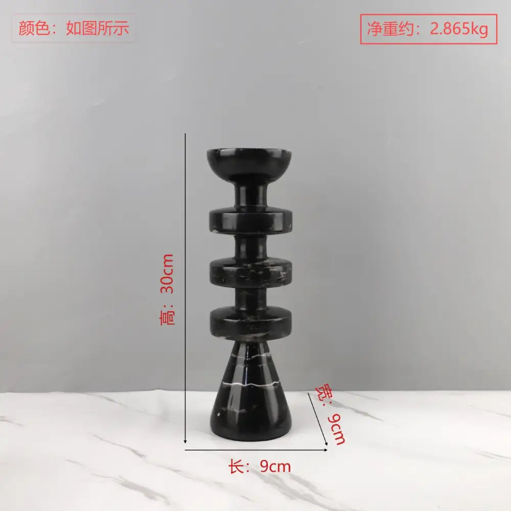 Decorbites black marble candle holder with stacked circular tiers and conical yellow stone base for modern decor