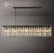 Modern rectangular chandelier with black metal frame and cascading clear crystal prisms from decorbites black marignan collection