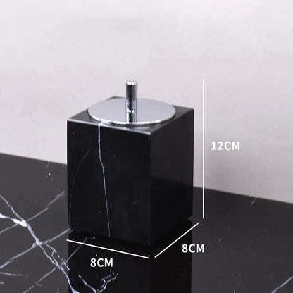 Black marquina cube-shaped toothbrush holder with sleek chrome lid and central stem from decorbites black marquina bathroom set