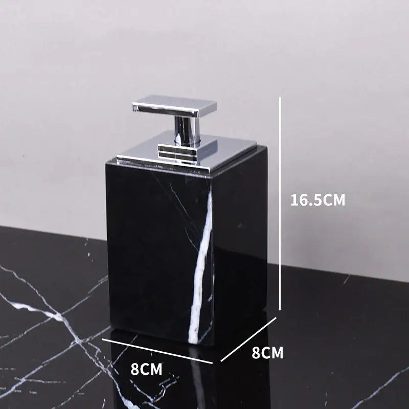 Black Marquina marble soap dispenser with a rectangular body and polished chrome pump from DecorBites black Marquina bathroom set