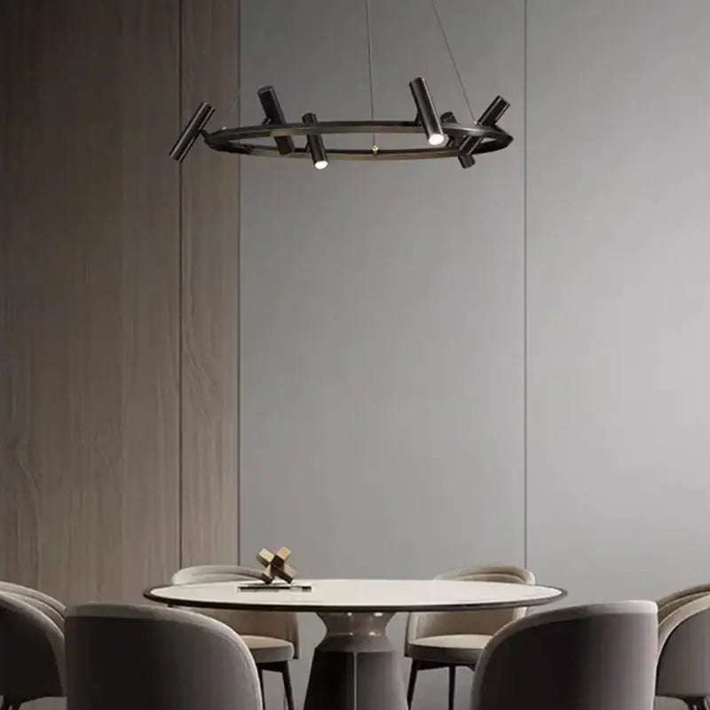 Decorbites black metal chandelier with black circular pendant and angular branch-like arms for minimalist dining room lighting