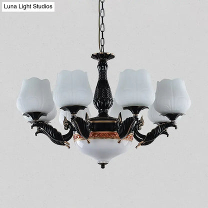 DecorBites black metal chandelier with ornate metalwork and frosted glass shades in white floral design