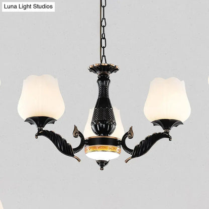 Elegant black metal chandelier with frosted glass tulip-shaped shades and gold accents from decorbites