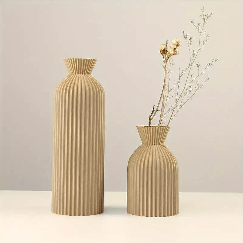 Beige ribbed ceramic vases with fluted necks shown with decorbites black plastic vase stylish boho decor centerpiece