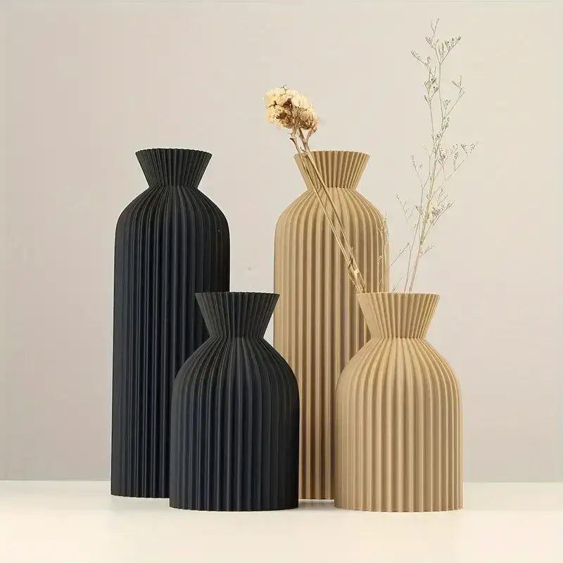 Set of four modern pleated DecorBites™ vases in matte black and beige plastic with sleek ribbed design and flared necks