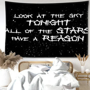 Decorbites black sky art tapestry featuring white distressed lettering on a black starry wall tapestry for bedroom decor
