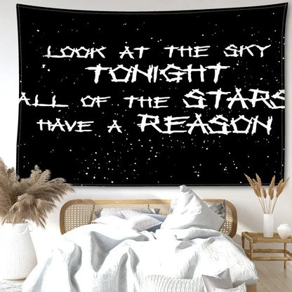 Decorbites black sky art tapestry featuring white distressed lettering on a black starry wall tapestry for bedroom decor