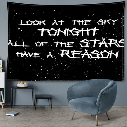 Decorbites black sky art tapestry featuring white distressed lettering on black starry fabric for bedroom wall decor