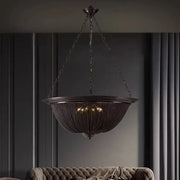 Dark bronze decorbites black tassel ceiling chandelier with intricate chain-link design and warm glowing lights