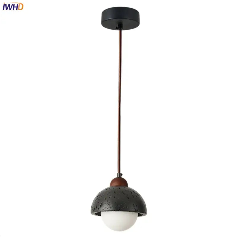 Decorbites black travertine led pendant lamp with black textured dome, white glass bulb, and copper accents for dining room