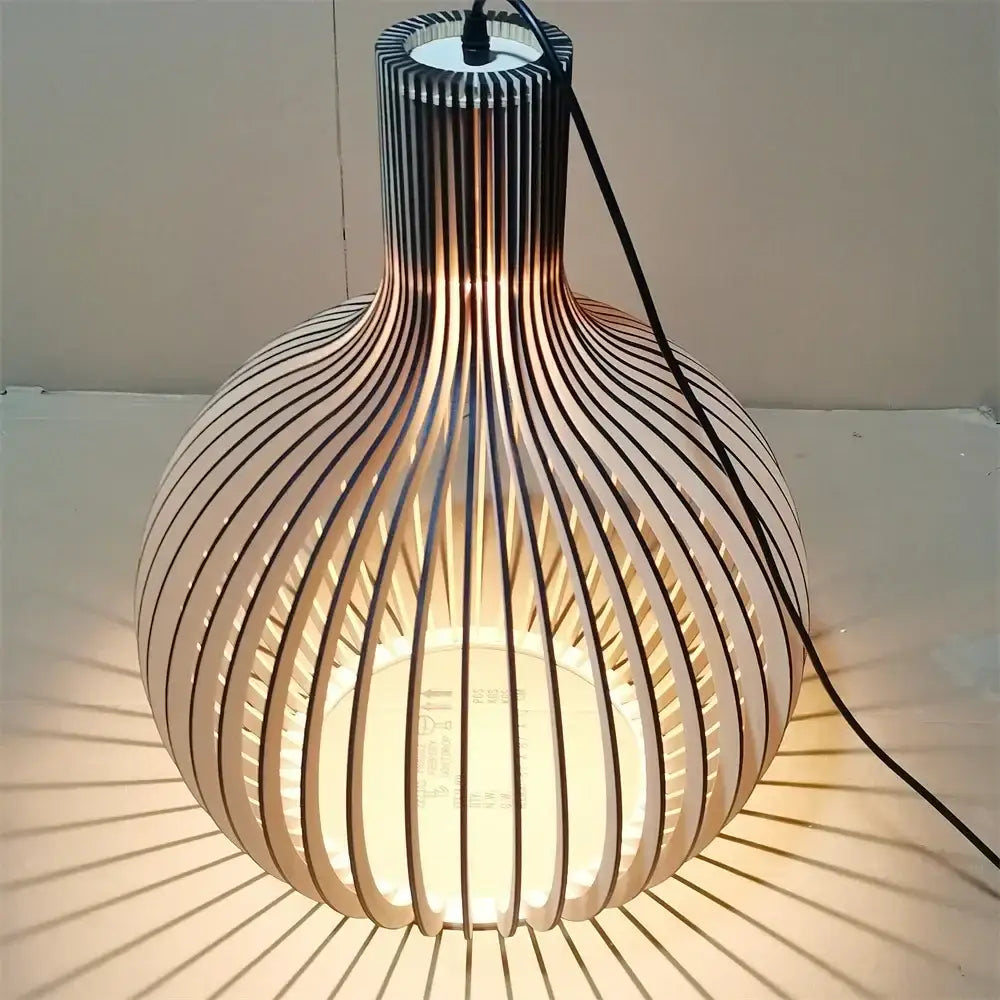 A modern decorbites black wood cage chandelier with spherical light wood slats and dark accents for living room lighting