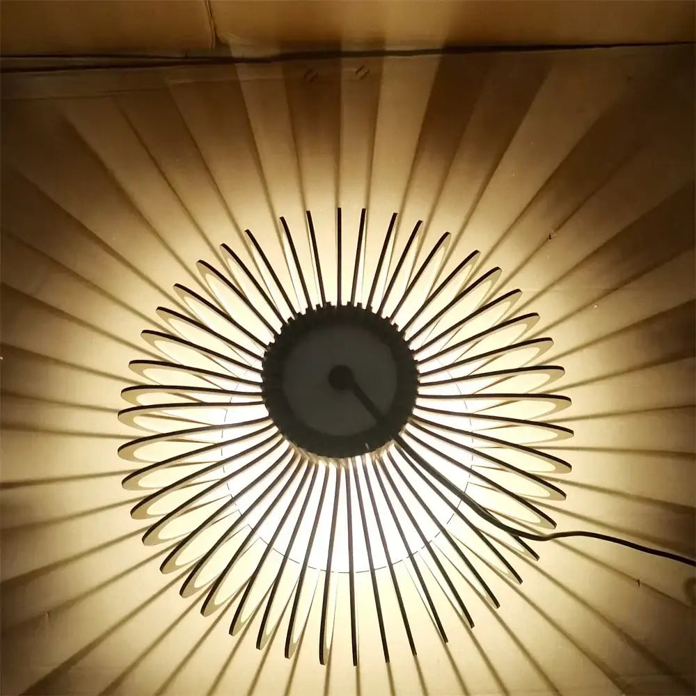 Decorbites black wood cage chandelier with slender black metal arms and a sunburst-style spherical ceiling light