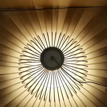 Decorbites black wood cage chandelier with slender black metal arms and a sunburst-style spherical ceiling light