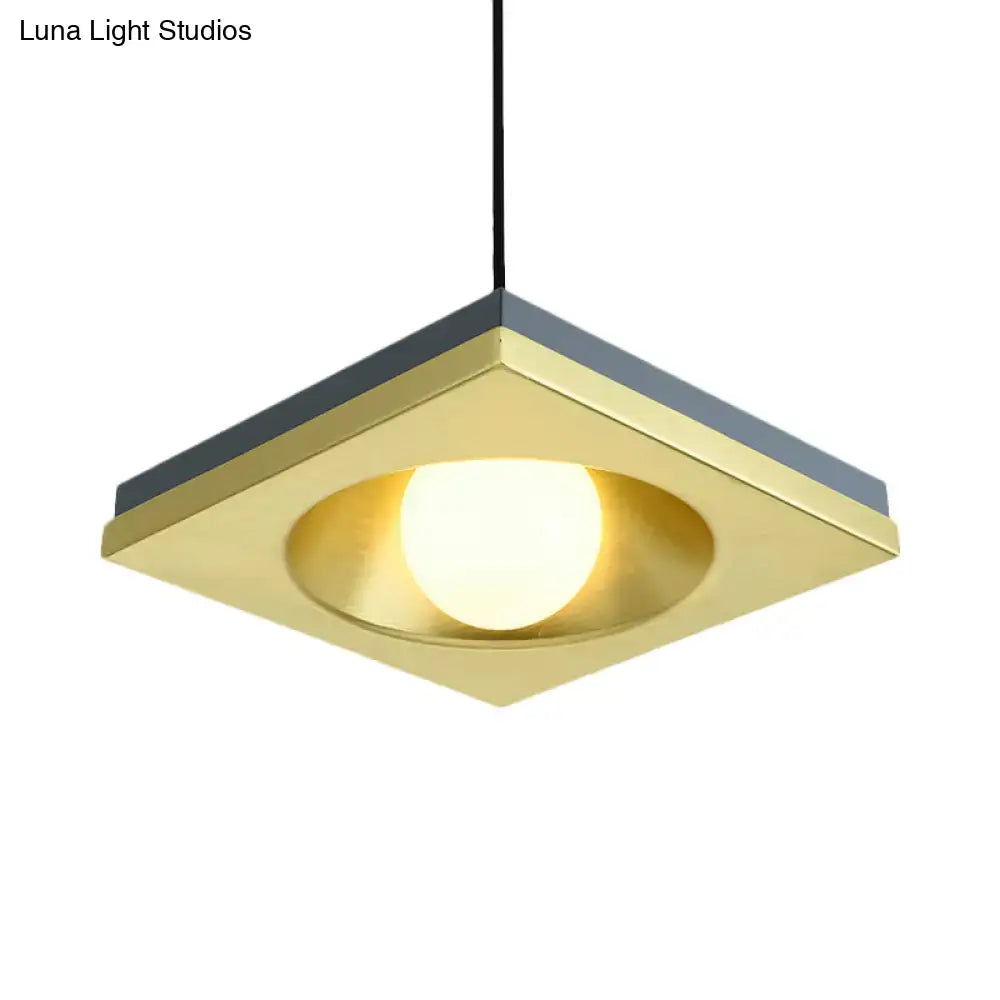 DecorBites™ pendant light with brushed brass square frame, matte gray accents, and warm-toned bulb base for bedrooms