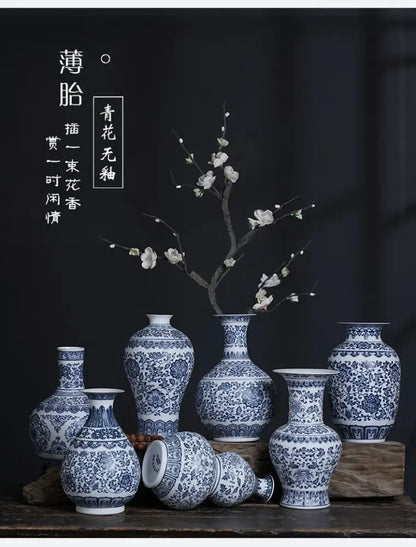 A collection of decorbites™ blue and white ceramic vases with intricate floral patterns perfect for elegant home decor