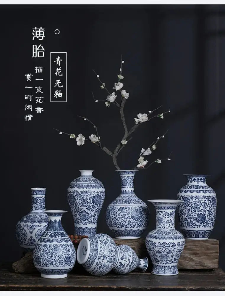 A collection of decorbites™ blue and white ceramic vases with intricate floral patterns perfect for elegant home decor