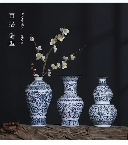 Three elegant blue and white ceramic vases with intricate floral patterns for stylish home decor by DecorBites™