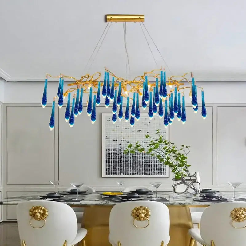 Decorbites blue crystal chandelier with blue glass teardrops and gold branching arms for dining room lighting
