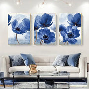 Set of three framed blue flowers print wall art with gold-colored frames for living room decor by DecorBites™