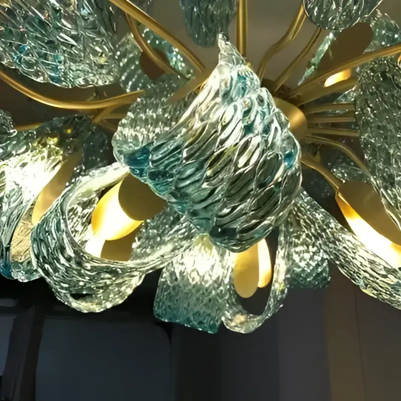 Decorbites™ blue glass led pendant lamps featuring a translucent teal glass chandelier with leaf-like arms and golden frame