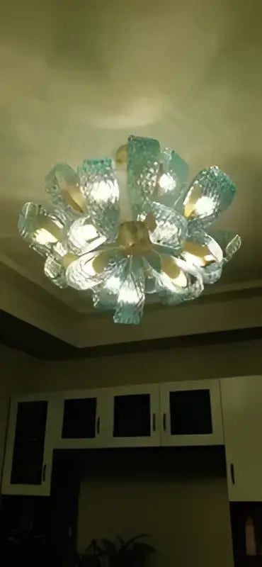 DecorBites™ blue glass led pendant lamps featuring a modern circular chandelier with turquoise glass petals and gold accents