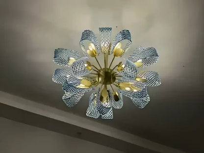 DecorBites™ blue glass led pendant lamps feature a delicate light blue glass chandelier with golden hub and petal arms