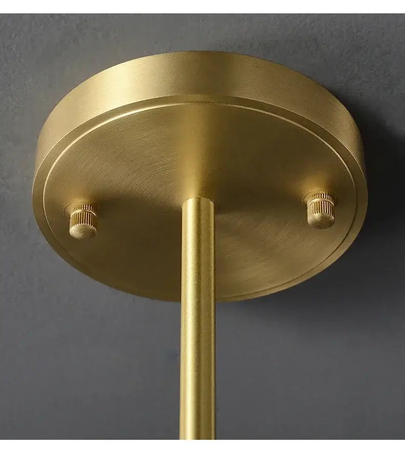 Brass-finished ceiling light fixture with circular base and central rod for DecorBites blue glass led pendant lamps