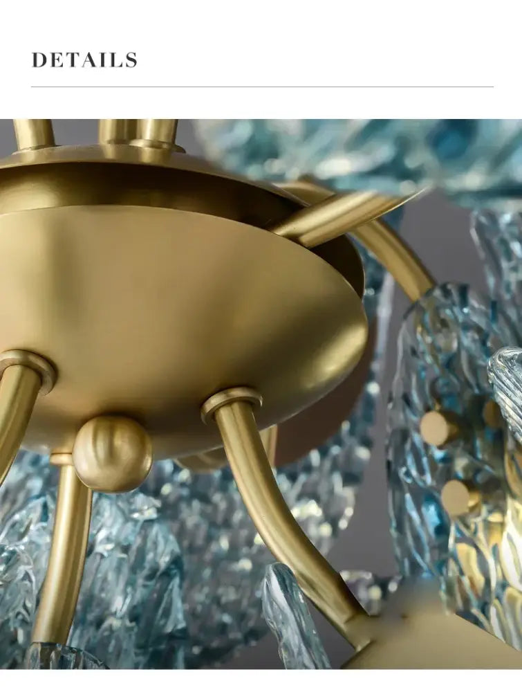 Gold-toned metal chandelier with intricate textured blue glass elements featuring blue glass led pendant lamps design