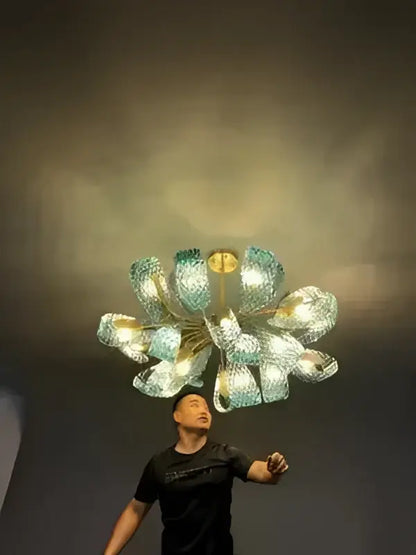 Decorbites™ blue glass led pendant lamps feature a modern multi-armed chandelier with teal and gold glass petals