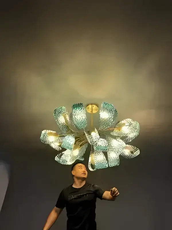 Decorbites™ blue glass led pendant lamps feature a modern multi-armed chandelier with teal and gold glass petals