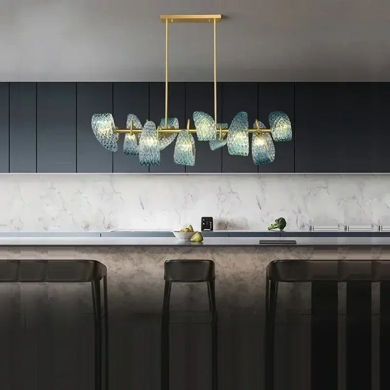 Modern chandelier with gold-toned metal frame and translucent blue glass led shades in pendant lamps design