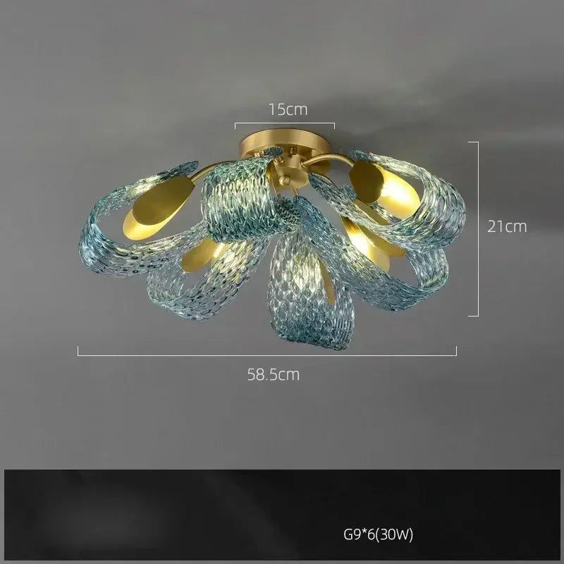 DecorBites™ blue glass led pendant lamps feature a gold-toned base with flowing translucent blue glass petals