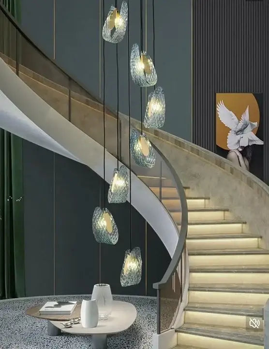 Elegant DecorBites™ blue glass LED pendant lamps feature cascading translucent glass shades emitting a warm glow