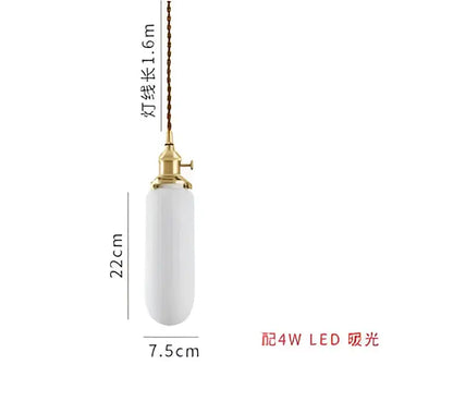 A sleek white ceramic pendant light with gold metal fixture and twisted cord for modern interiors decorbites blue glass pendant