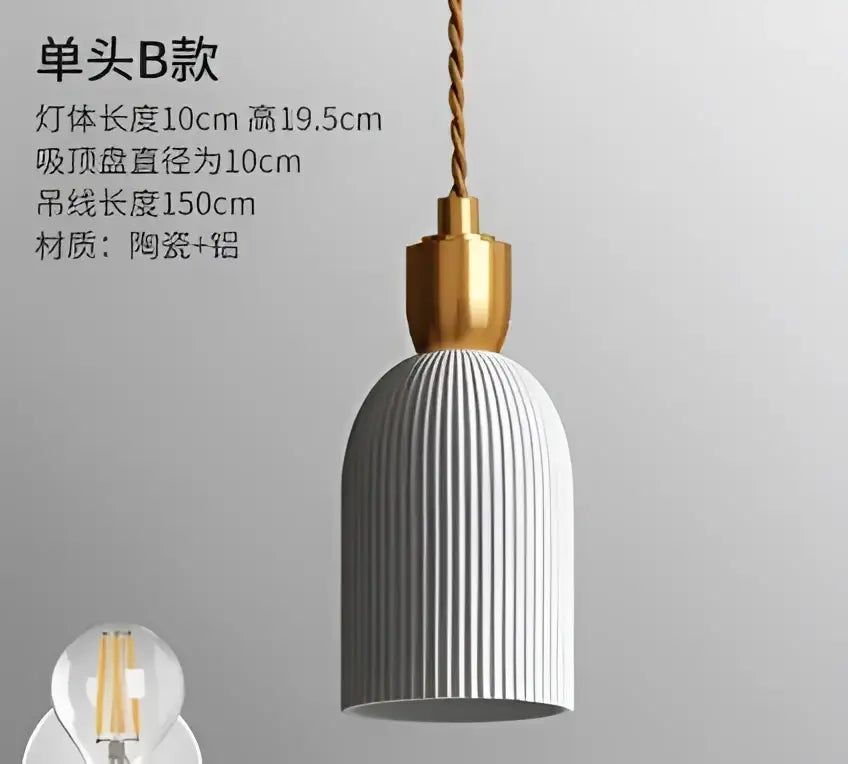 White ribbed ceramic pendant light with gold-toned metal top and twisted cord complementing decorbites blue glass pendant light