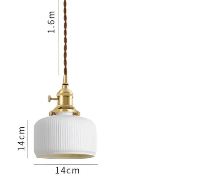 White ribbed glass pendant light with brass fixture and twisted cord complementing decorbites blue glass pendant light