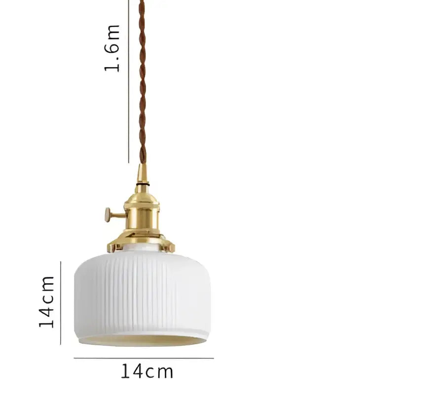 White ribbed glass pendant light with brass fixture and twisted cord complementing decorbites blue glass pendant light