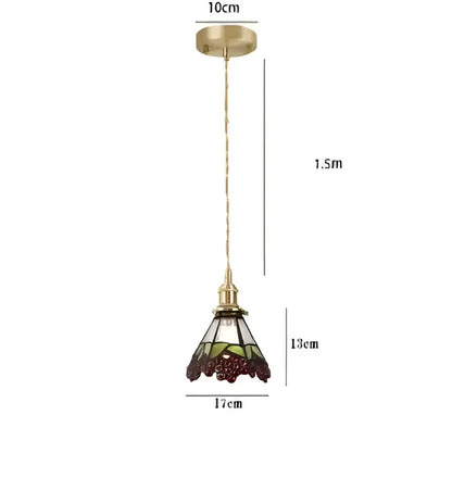 Vintage-style pendant lights with brass frame and stained glass shade featuring intricate grapevine patterns for dining room decorbites blue glass pendant
