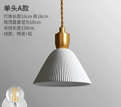 White ribbed ceramic pendant light with gold metal fixture and twisted cord complementing decorbites blue glass pendant lights