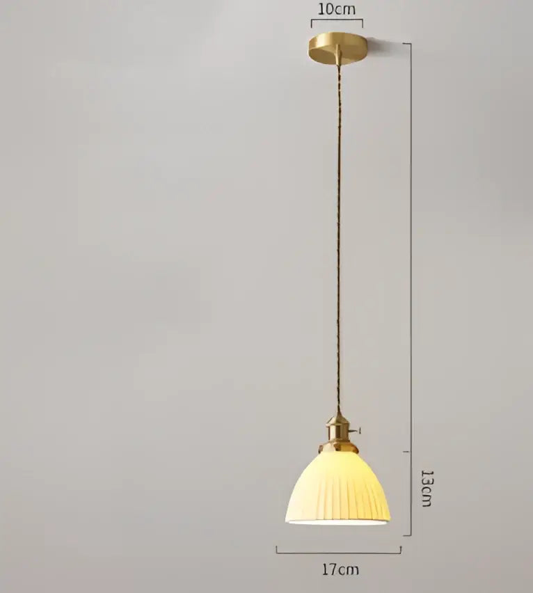 A vintage-style pendant light with brass frame and cream ribbed shade for dining room by decorbites blue glass pendant lights