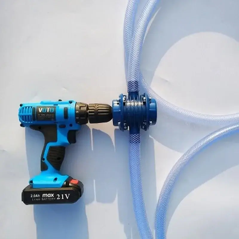 Decorbites blue self-priming centrifugal pump connected to black blue cordless drill and translucent tubing for kitchen garden use