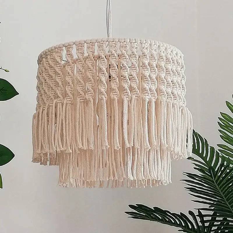 A cream-colored bohemia cotton rope chandelier with tiered fringe design for dining and living room decor