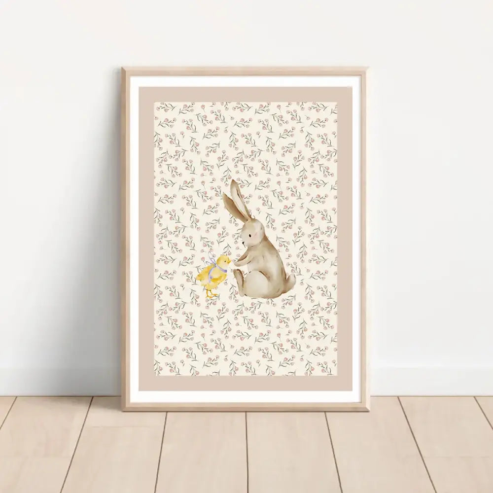A framed bohemian style wall art set featuring a soft beige rabbit and yellow duck watercolor print with floral background