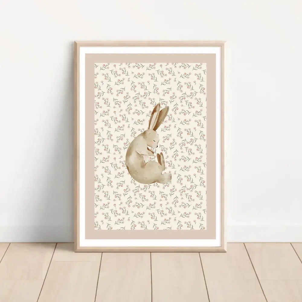 A framed bohemian style wall art set featuring a soft beige rabbit watercolor print with floral background